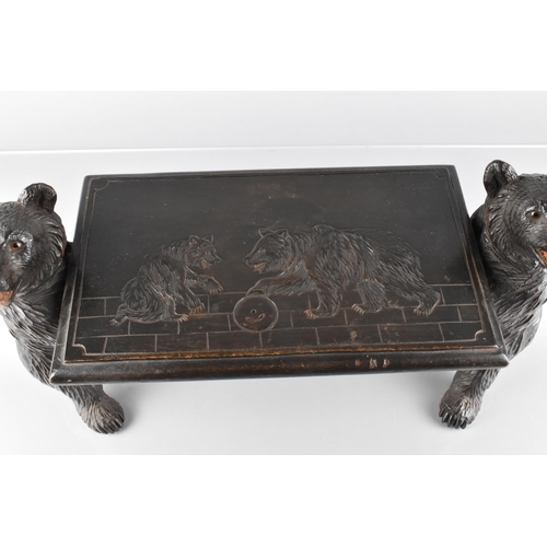 66 - A Late 19th Century Black Forest Table Top Stand Modelled with Carved Bears Supporting Carved Top, D... 