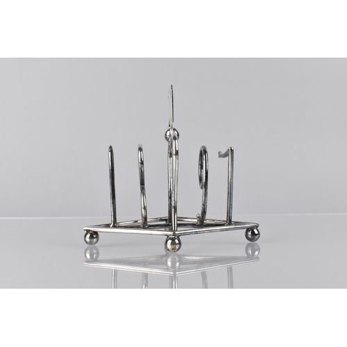 213 - Christopher Dresser (1843-1904), A Victorian Silver Plated Four Slice Toast Rack 