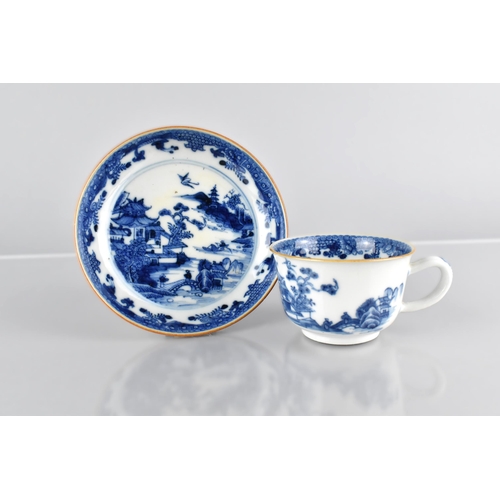 418 - A Chinese Qing Dynasty Porcelain Blue and White Cup and Saucer Decorated with River Village Scene, 1... 