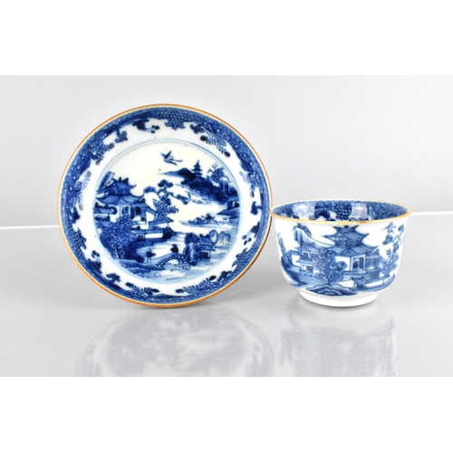 418 - A Chinese Qing Dynasty Porcelain Blue and White Cup and Saucer Decorated with River Village Scene, 1... 