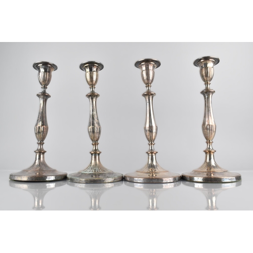 212 - A Set of Four 19th Century Sheffield Plated Candlesticks, 28cm High, Weighted Bases