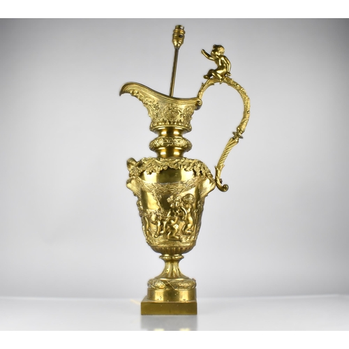 149 - A Large Decorative Gilt Metal Lamp Formed as a Classical Ewer with Scroll Handle Surmounted by Cheru... 