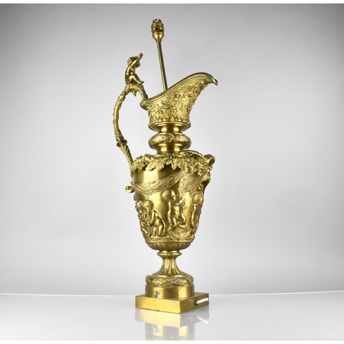 149 - A Large Decorative Gilt Metal Lamp Formed as a Classical Ewer with Scroll Handle Surmounted by Cheru... 