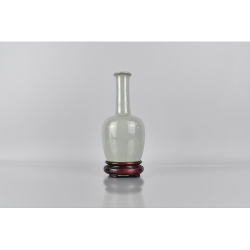 381 - A Chinese Celadon Glazed Bottle Vase, The Base with 37 Character Inscription for Qianlong, 19cm High... 