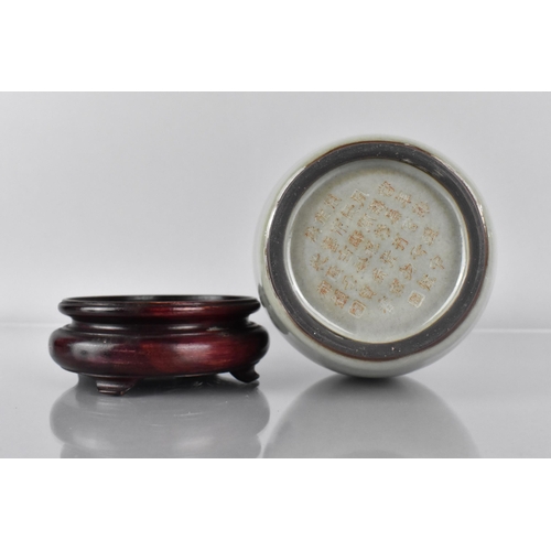 381 - A Chinese Celadon Glazed Bottle Vase, The Base with 37 Character Inscription for Qianlong, 19cm High... 