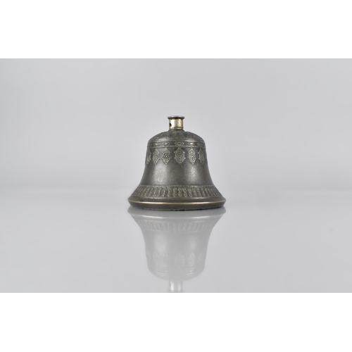 68 - A White Metal Cast Tibetan Bell Moulded with Eight Lanca Characters and Dorje Motifs, 9cm High