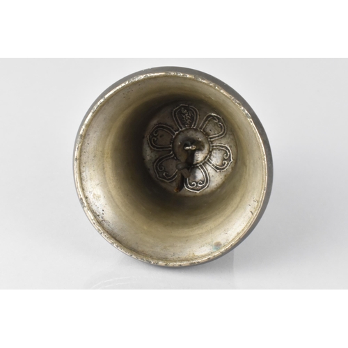 68 - A White Metal Cast Tibetan Bell Moulded with Eight Lanca Characters and Dorje Motifs, 9cm High