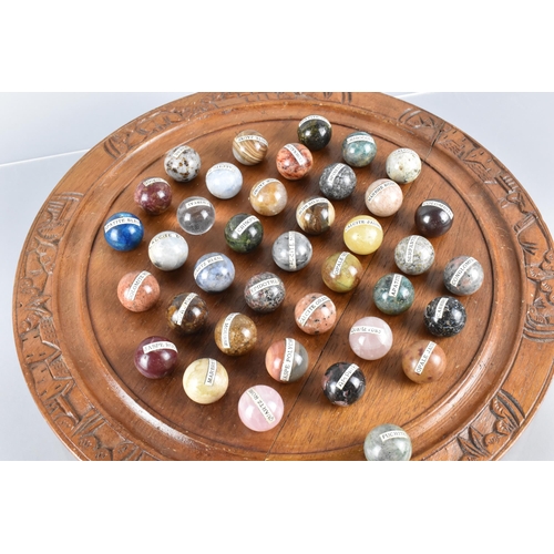 52 - A Collection of Thirty-Eight Labelled Polished Geological Specimen Marbles Housed in Carved Wooden S... 