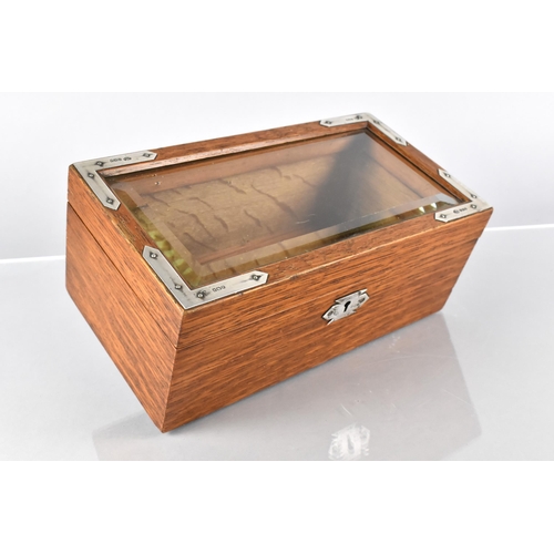 3 - An Edwardian Silver Mounted Oak Bijouterie Box, with a Bevelled Glass Top, the Silver Mounts London ... 