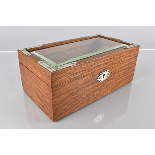 3 - An Edwardian Silver Mounted Oak Bijouterie Box, with a Bevelled Glass Top, the Silver Mounts London ... 