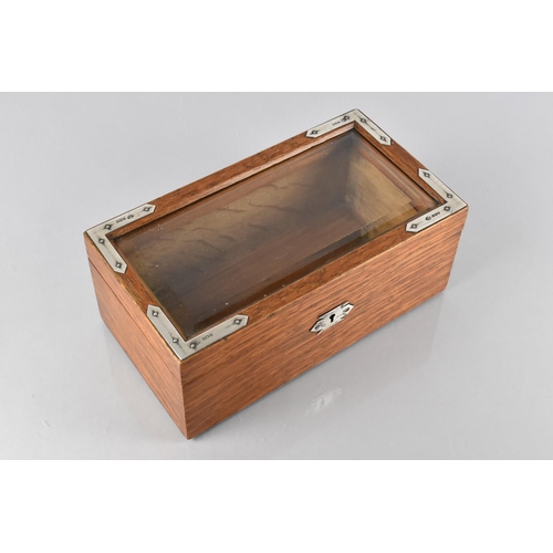 3 - An Edwardian Silver Mounted Oak Bijouterie Box, with a Bevelled Glass Top, the Silver Mounts London ... 