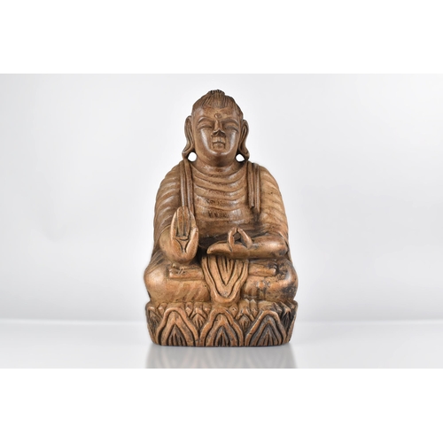 67 - A 19th Century East Indian Carved Hardwood Figure of a Seated Buddha on a Stylised Lotus Plinth, 32c... 