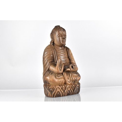 67 - A 19th Century East Indian Carved Hardwood Figure of a Seated Buddha on a Stylised Lotus Plinth, 32c... 