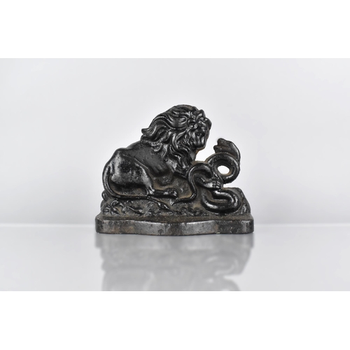 125 - A 19th Century Cast Iron Doorstop, Modelled as The Lion and Snake, an Allegory of Strength over Adve... 