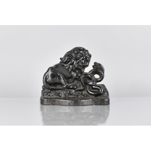 125 - A 19th Century Cast Iron Doorstop, Modelled as The Lion and Snake, an Allegory of Strength over Adve... 