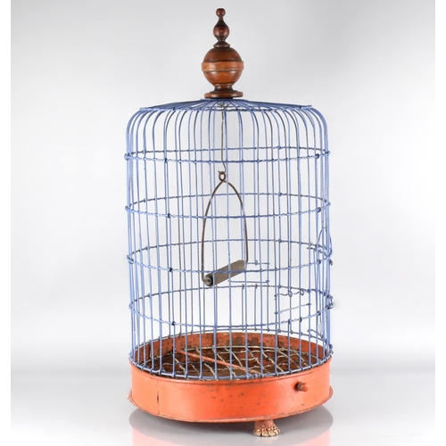 82 - A 19th Century Painted Metal Birdcage with a Turned Wooden Finial, and Supported on Three Gilt Lions... 