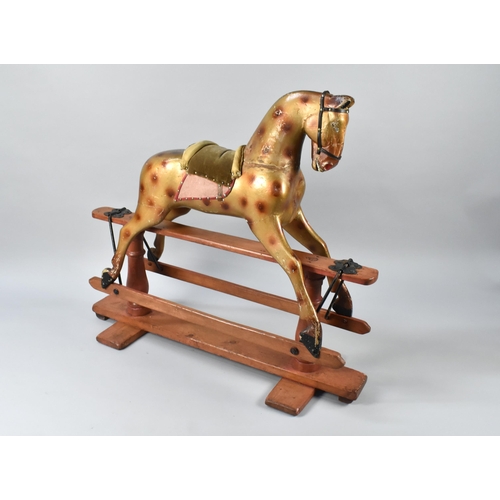 83 - An Early 20th Century Rocking Horse, Painted Wood, Mounted on a Turned Wooden Swing-Stand in the Sty... 