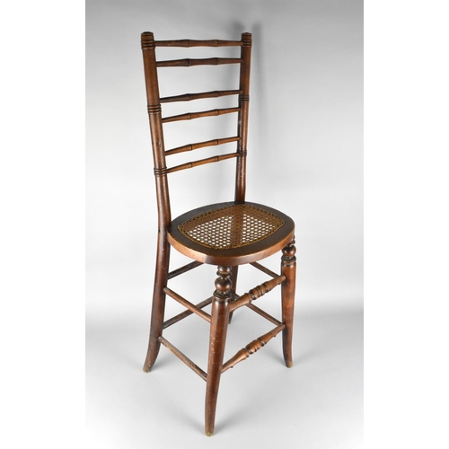 446 - A Late 19th Century Faux Bamboo Framed and Cane Seated Correction Chair, 93.5cm High