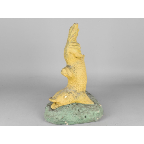 523 - A Reconstituted Stone Garden Ornament Modelled as a Dolphin, 42cm high