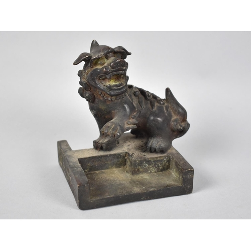 234 - A Heavy Chinese Bronze Seal in the Form of a Temple Dog with One Paw Raised, Square Base, 9.5cms