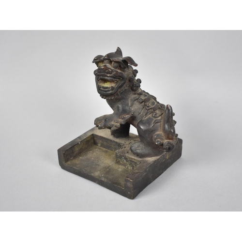 234 - A Heavy Chinese Bronze Seal in the Form of a Temple Dog with One Paw Raised, Square Base, 9.5cms