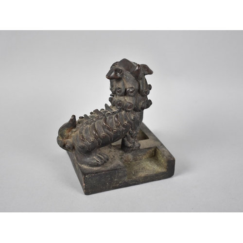 234 - A Heavy Chinese Bronze Seal in the Form of a Temple Dog with One Paw Raised, Square Base, 9.5cms