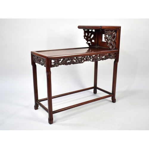 250 - A Chinese Hardwood Two Tier Stand with Pierced Carved Dragon Decoration and Apron, 71cms Long