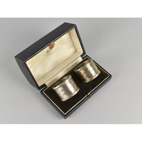 495 - A Cased Pair of Engine Turned Napkin Rings by Mappin & Webb Ltd, Monogrammed E.S, Birmingham Hallmar... 