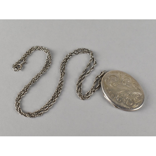 507 - A Large Silver Locket on Silver Chain, the Locket Hallmarked for London 1972, Locket 5cmx4cm Chain 6... 