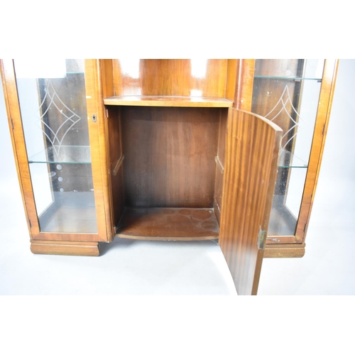 555 - A 1950s Walnut Veneered Side to Side Display Cabinet with Bow Fronted Centre Cabinet and Open Sectio... 