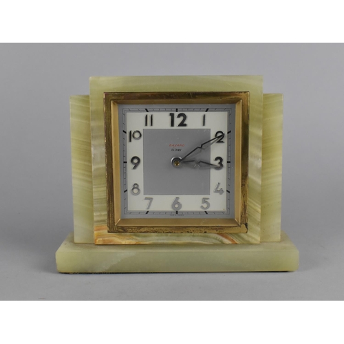 65 - An Art Deco Onyx and Brass Mantel Clock by Bayard, Eight Day Movement, 16cms Wide, Working Order