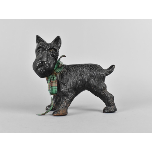 69 - A Cold Painted Cast Iron Doorstop in the Form of a Scotty Dog Cocking Leg, 19cms Long