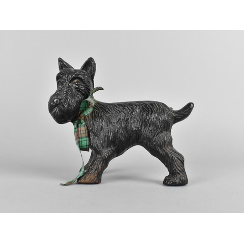 69 - A Cold Painted Cast Iron Doorstop in the Form of a Scotty Dog Cocking Leg, 19cms Long