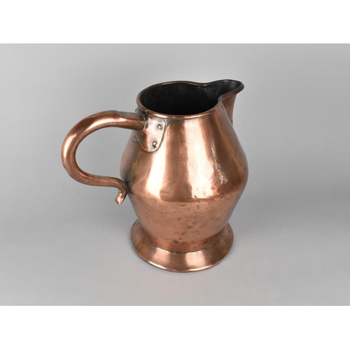 88 - A Heavy and Large 19th Century Copper Jug, 30cms High