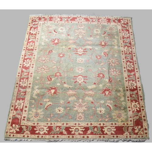 469 - A Vintage Patterned Rug on Green Ground with Cream and Red Design, 256x229