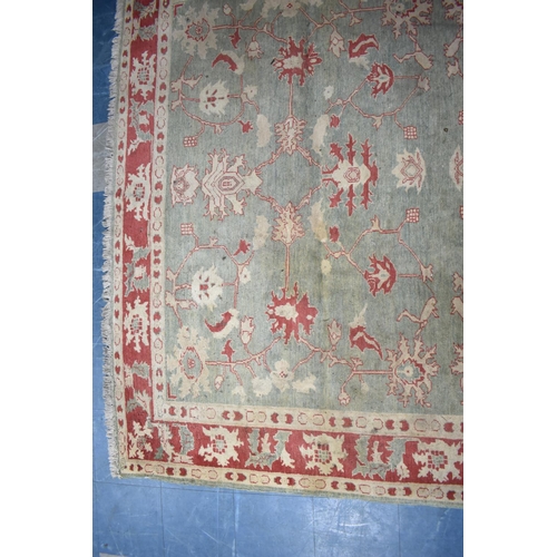 469 - A Vintage Patterned Rug on Green Ground with Cream and Red Design, 256x229