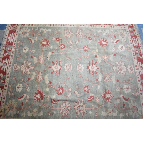 469 - A Vintage Patterned Rug on Green Ground with Cream and Red Design, 256x229