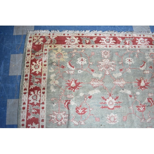 469 - A Vintage Patterned Rug on Green Ground with Cream and Red Design, 256x229