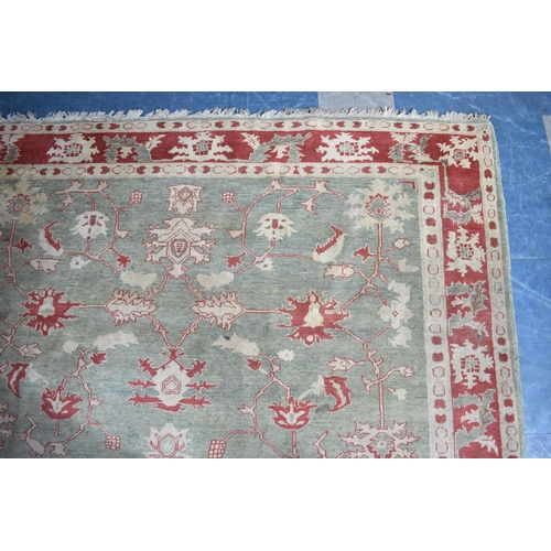 469 - A Vintage Patterned Rug on Green Ground with Cream and Red Design, 256x229