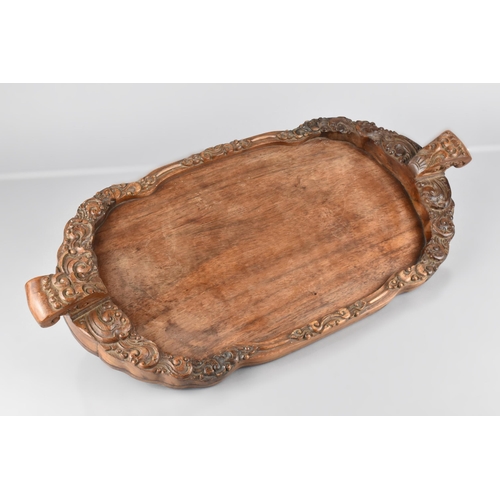 114 - A Chinese Late Qing Dynasty Hardwood Tray with Carved Galleried Sides and Twin Handles, 51cm Wide