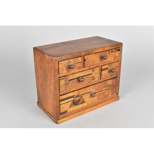 1 - A Miniature Tabletop Collectors Chest having Five Drawers inlaid with Geometric Decoration, 14.5cms ... 