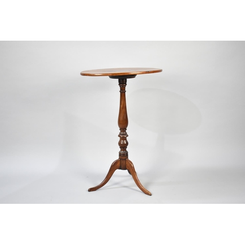 104 - An Edwardian Mahogany Oval Topped Tripod Wine Table, 53cms Wide and 76cms High