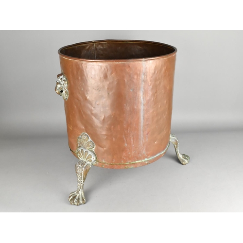 106 - A Large Copper Coal Bucket with Lion Mask Handles and Three Claw Feet, 37cms Diameter and 44cms High... 