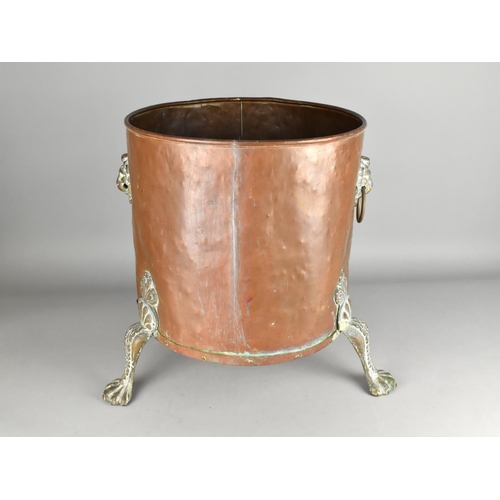 106 - A Large Copper Coal Bucket with Lion Mask Handles and Three Claw Feet, 37cms Diameter and 44cms High... 