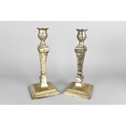 121 - A Pair of Silver Plated Brass Candlesticks , 25.5cms High