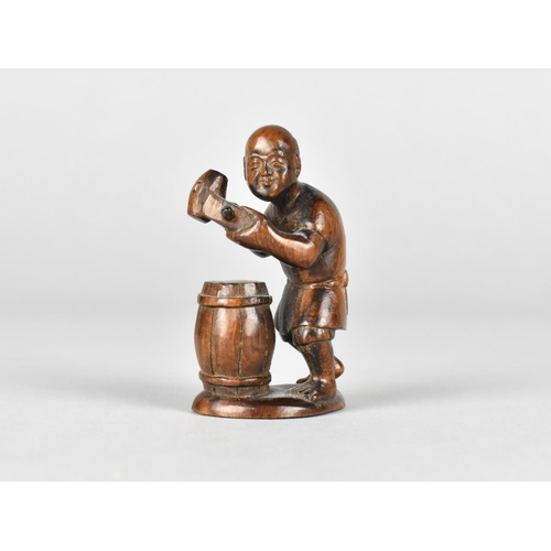 32 - A Carved Netsuke in the Form of a Craftsman Beside Barrel, Signed to Base, 6cms High