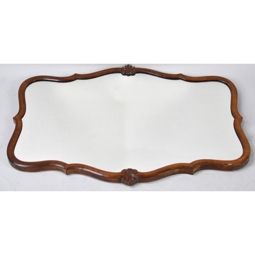 550 - A Mid 20th Century Walnut Framed Wall Mirror, 79x57cms