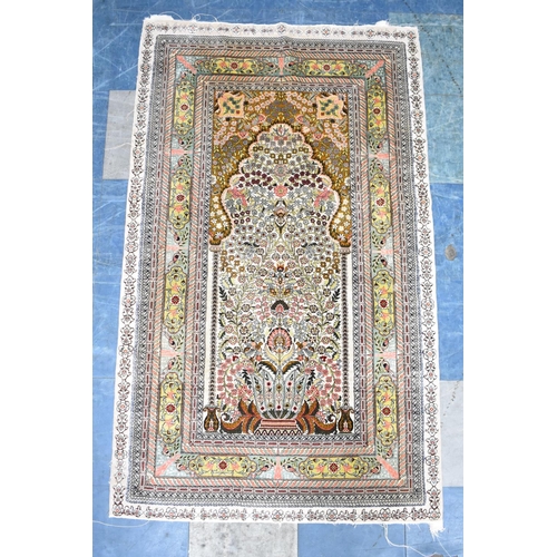 557 - A Finely Patterned Silk Rug, 153x93cms