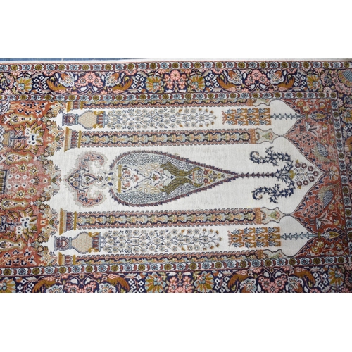 558 - A Patterned Cotton and Silk Rug, 156x92cms