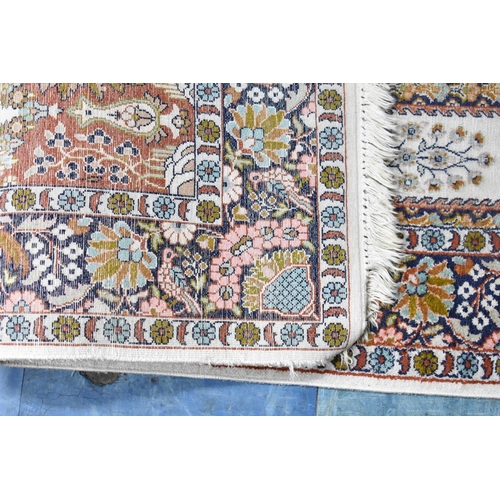 558 - A Patterned Cotton and Silk Rug, 156x92cms